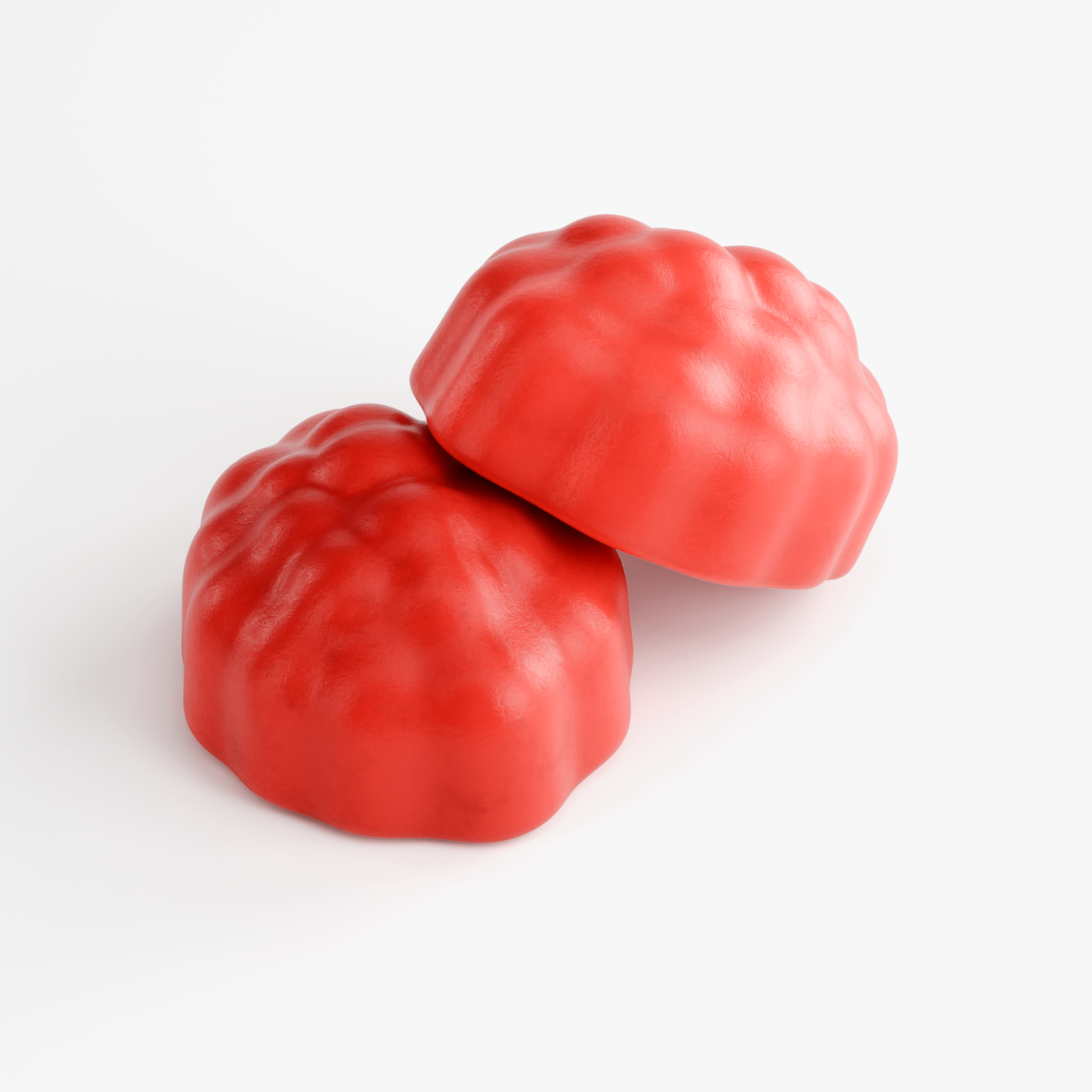 Close-up of two red berry-shaped passion fruit gummies